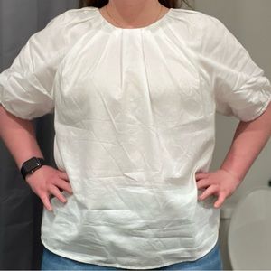 White crew neck Ann Taylor shirt. Elastic sleeves. Pleated at the neck line.